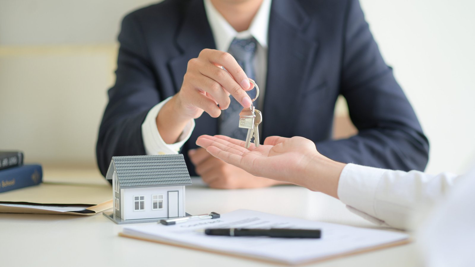 home under contract seller signing paperwork